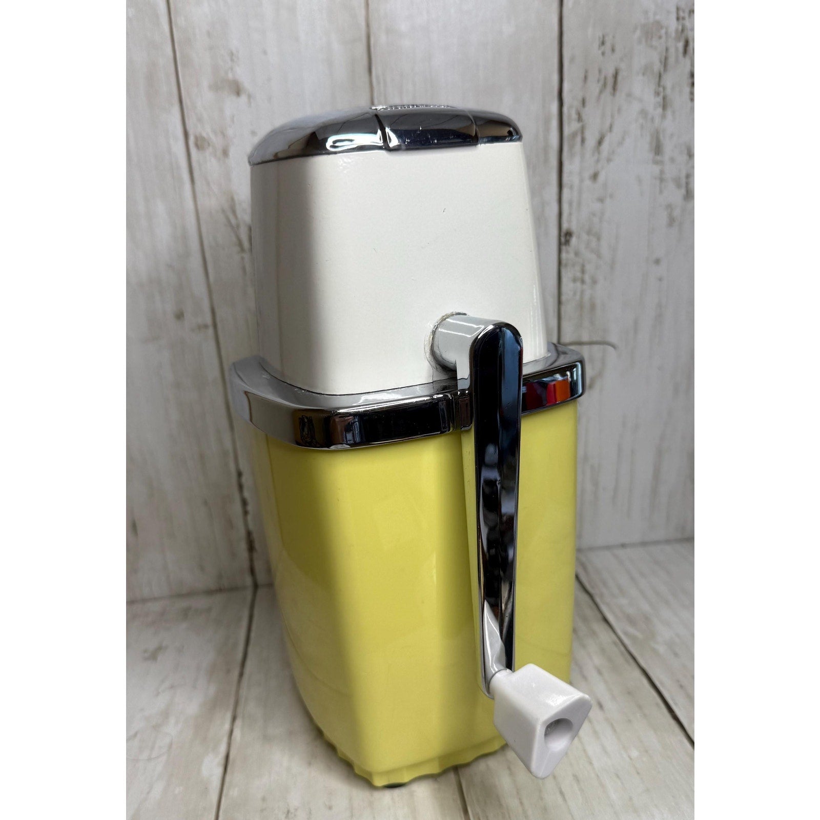 Yellow and White Manual Ice Crusher