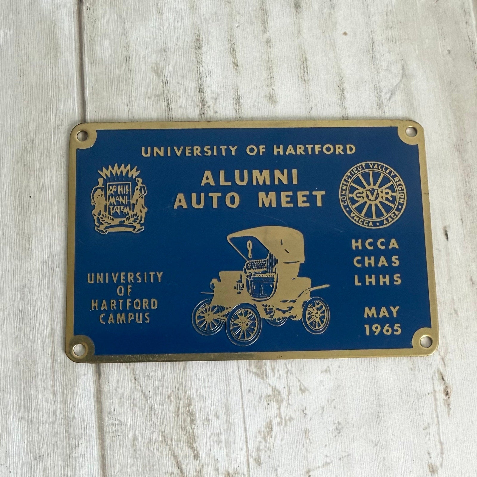1965 University of Hartford Alumni Auto Meet Dashboard Badge