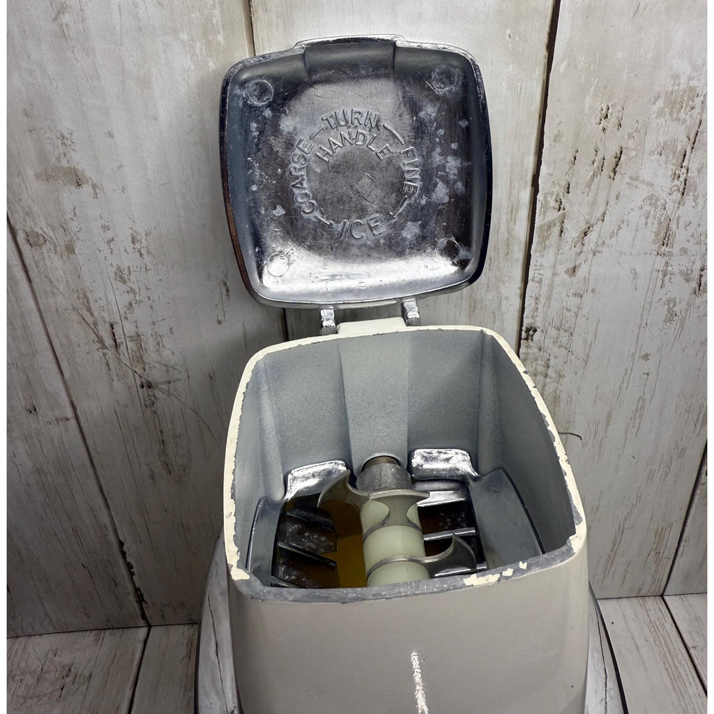 Yellow and White Manual Ice Crusher