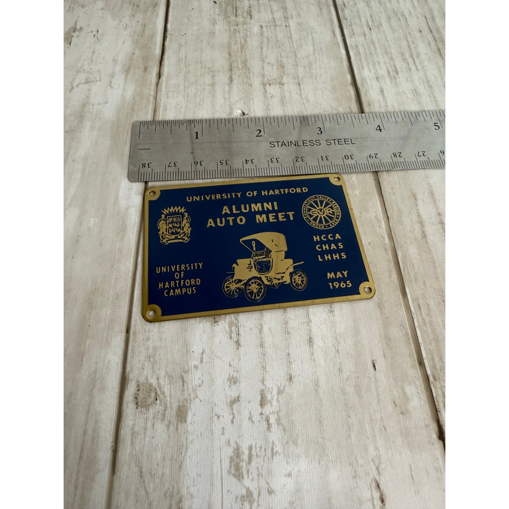 1965 University of Hartford Alumni Auto Meet Dashboard Badge